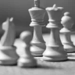 5 Black and white chess pieces representing 5 lessons i have learned from chess